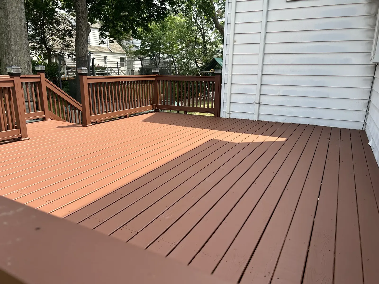 Finished exterior deck boards and railing