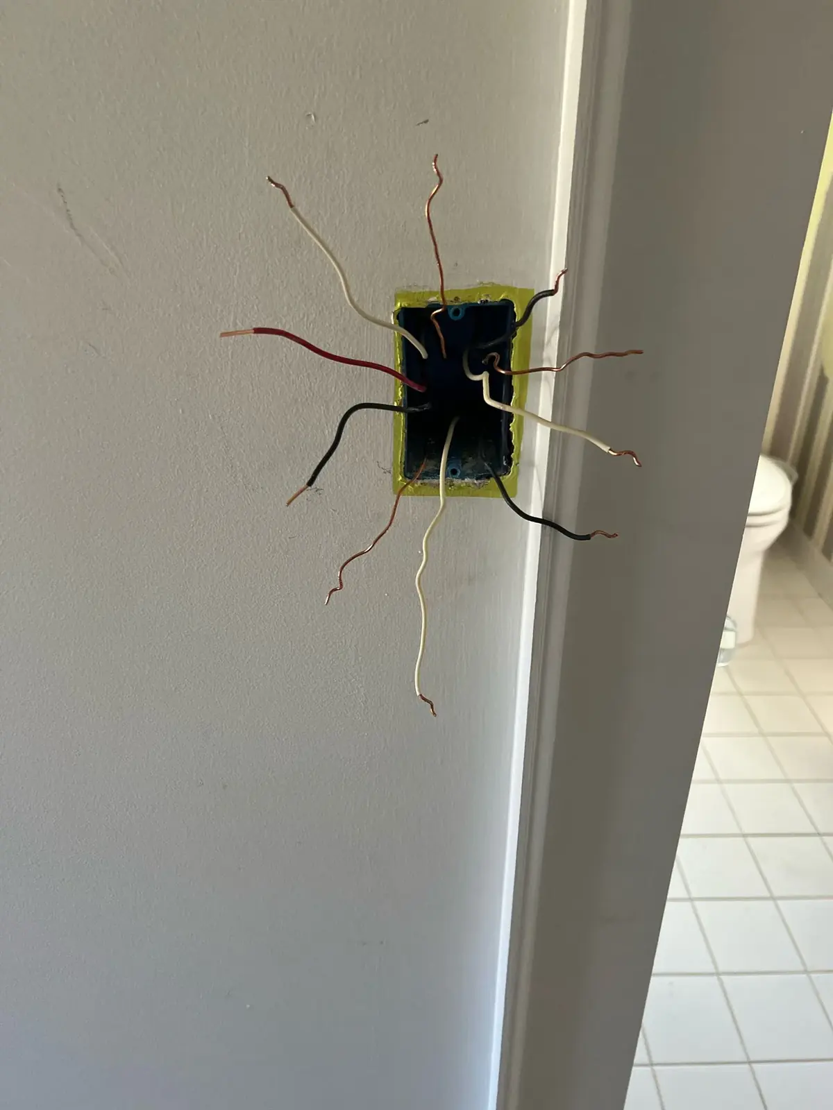 Electrical box and exposed wiring during construction support