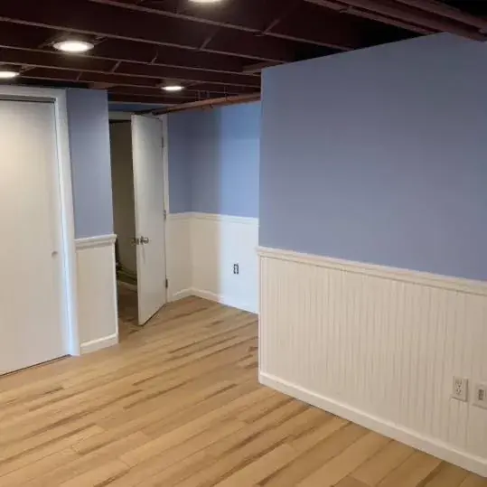 Light wood flooring and white trim detail